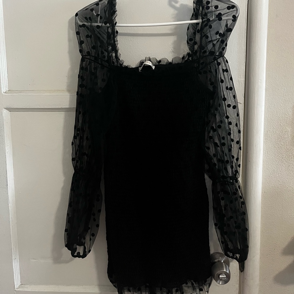 Black mini dress. Puffy polka dot sleeves. Brand New with tags from MissLola.